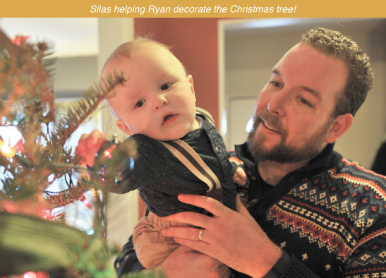 Silas helping Ryan decorate the Christmas tree!